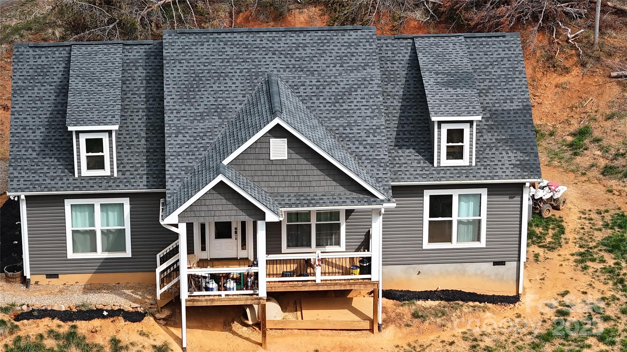 19 Higgins Road Weaverville, NC 28787 - Photo 15 of 48 a front view of a house with a yard outdoor seating and barbeque oven