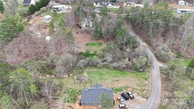 an aerial view of house with yard