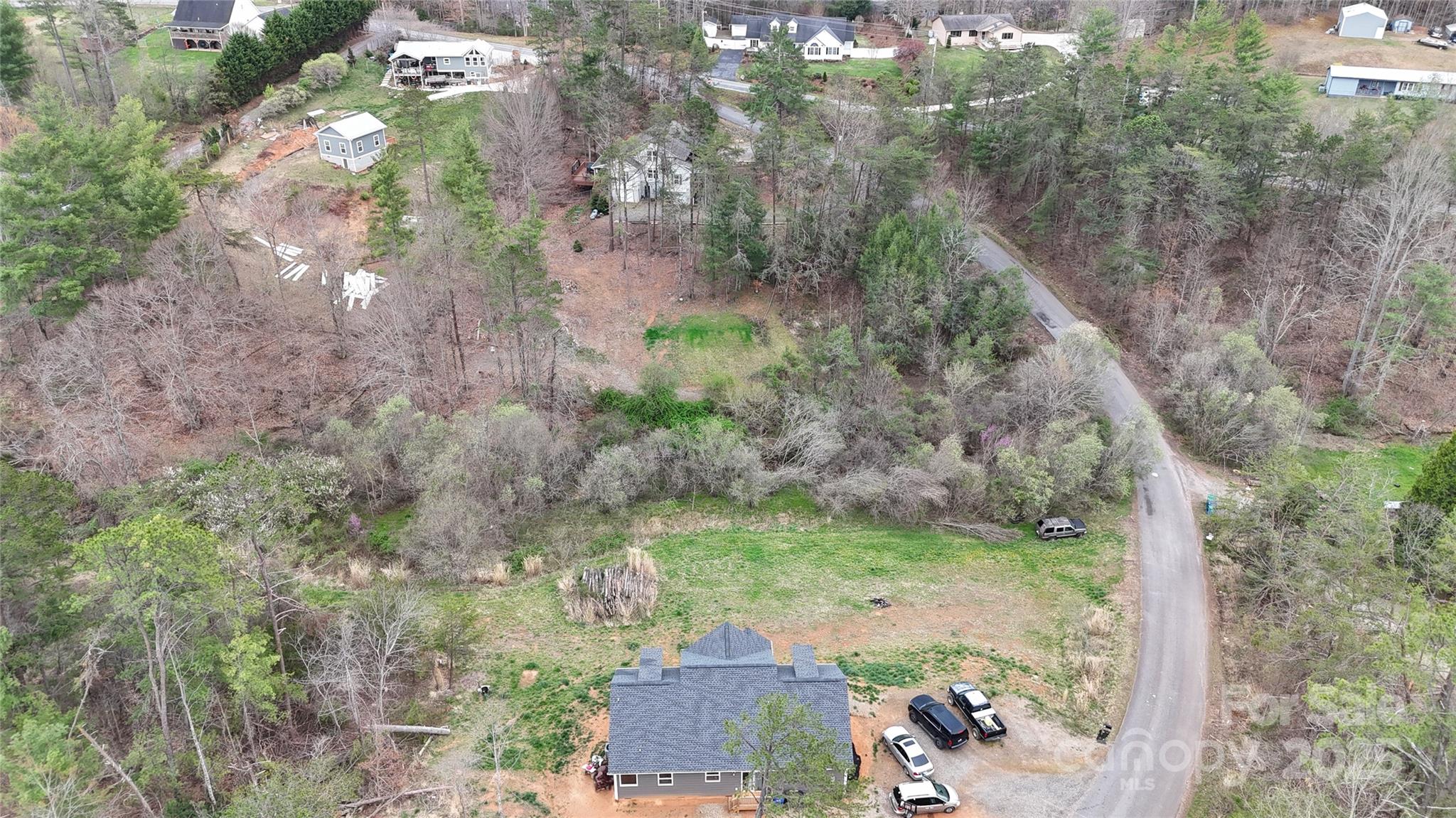 19 Higgins Road Weaverville, NC 28787 - Photo 16 of 48 a view of a garden with a tree