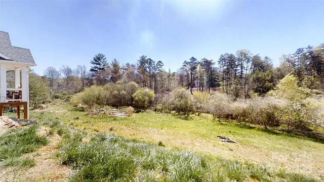 a view of a house with a snow in the yard