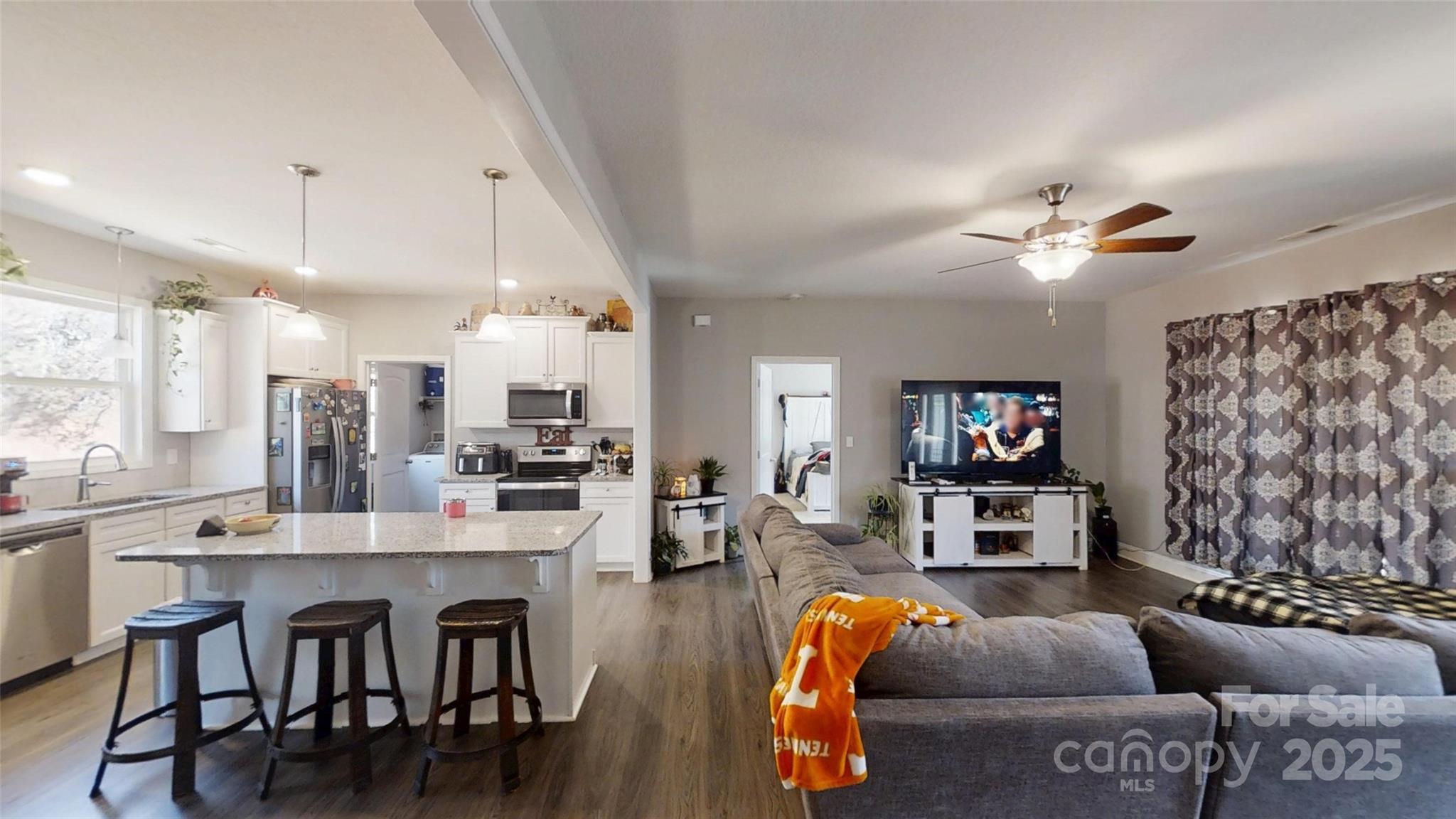 19 Higgins Road Weaverville, NC 28787 - Photo 28 of 48 a living room with furniture kitchen view and a chandelier