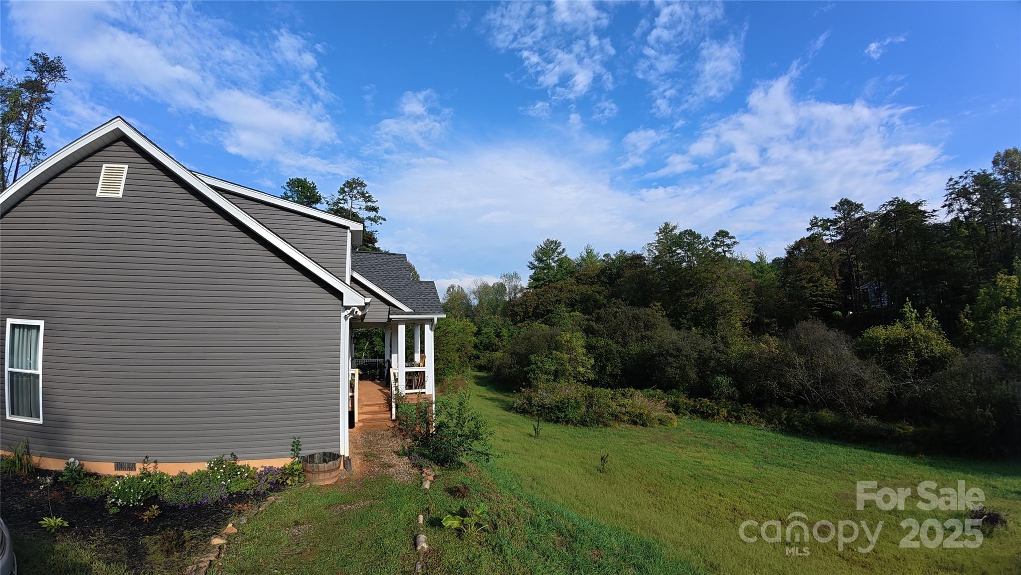 19 Higgins Road Weaverville, NC 28787 - Photo 3 of 48 a house with garden in front of it