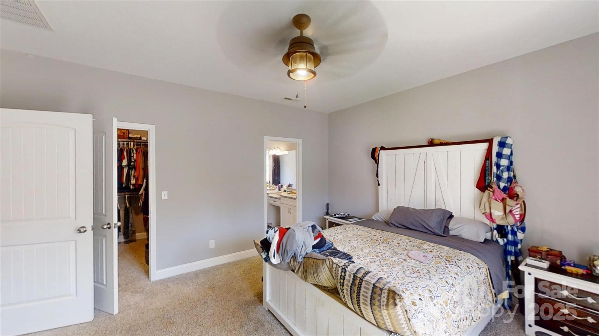 19 Higgins Road Weaverville, NC 28787 - Photo 41 of 48 a bedroom that has a bed and a chandelier