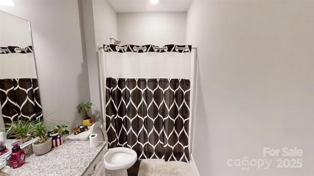 a bedroom with a bed and flat tv screen