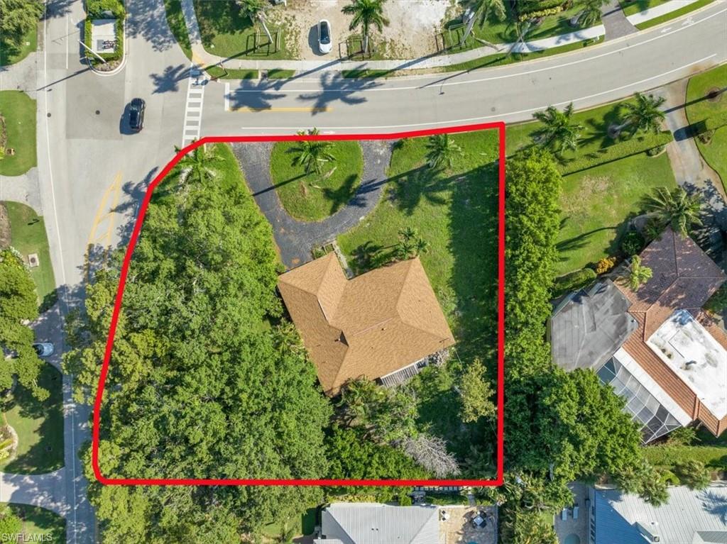 444 Orchid Drive Naples, FL 34102 - Photo 2 of 8 an aerial view of a house with a yard and garden