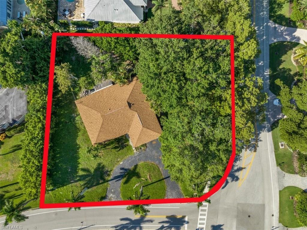 444 Orchid Drive Naples, FL 34102 - Photo 4 of 8 an aerial view of a flower garden