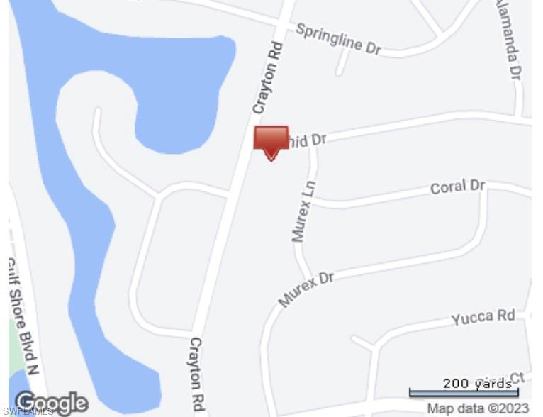 444 Orchid Drive Naples, FL 34102 - Photo 7 of 8 a bathroom with a shower and mirror