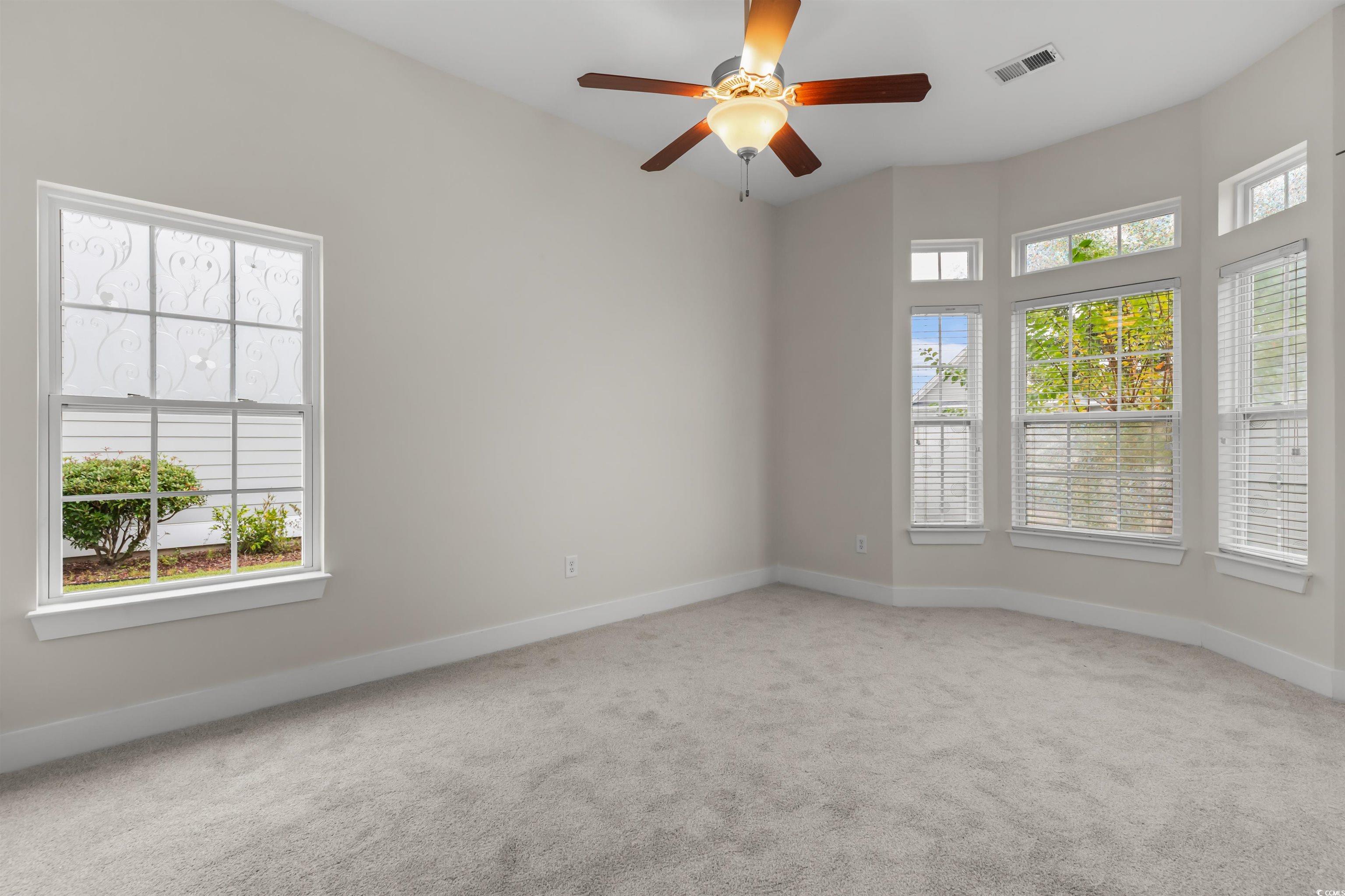2006 Heritage Loop Myrtle Beach, SC 29577 - Photo 13 of 33 Carpeted empty room featuring baseboards and a ceiling fan