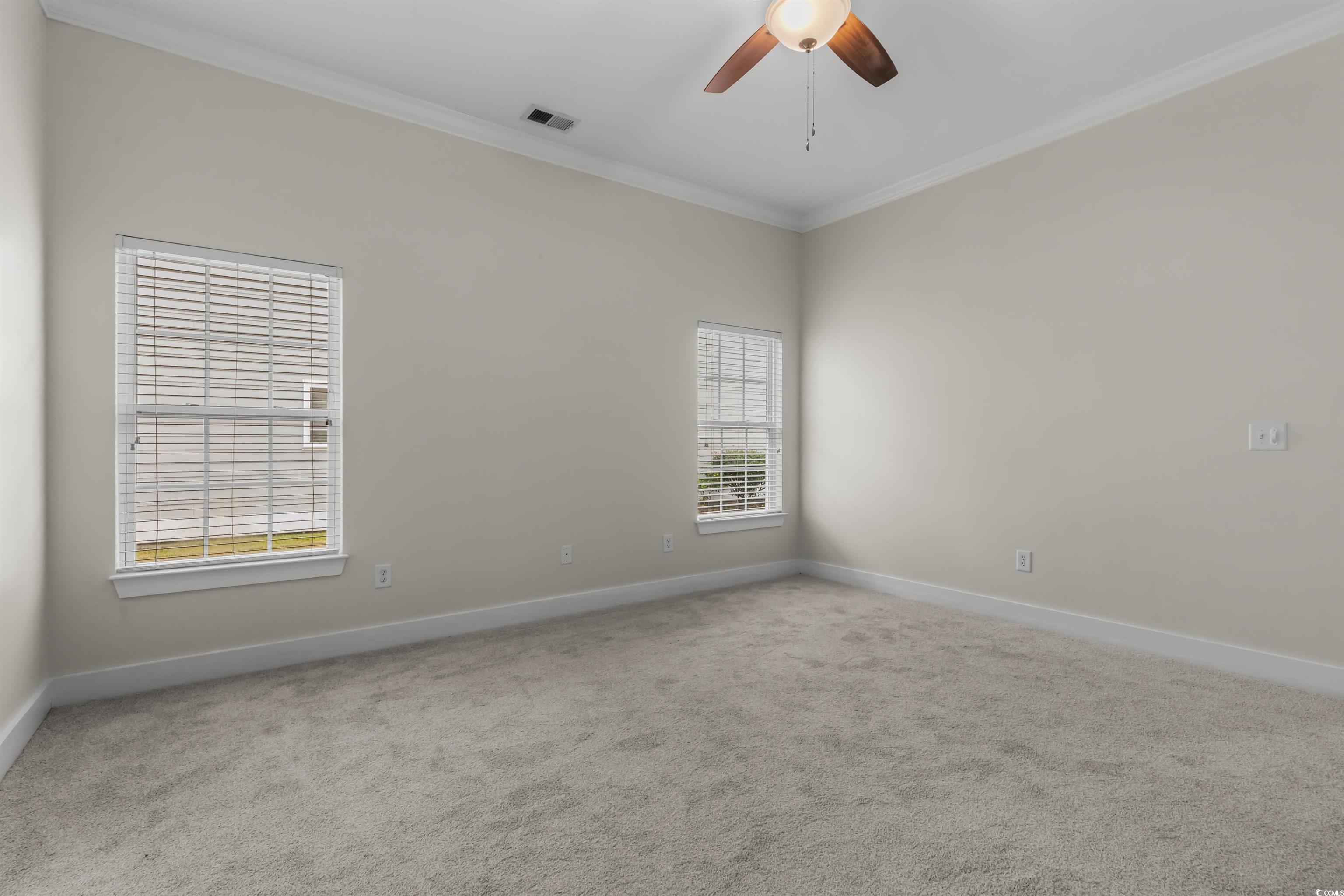 2006 Heritage Loop Myrtle Beach, SC 29577 - Photo 18 of 33 Unfurnished room featuring ornamental molding, carpet flooring, and ceiling fan