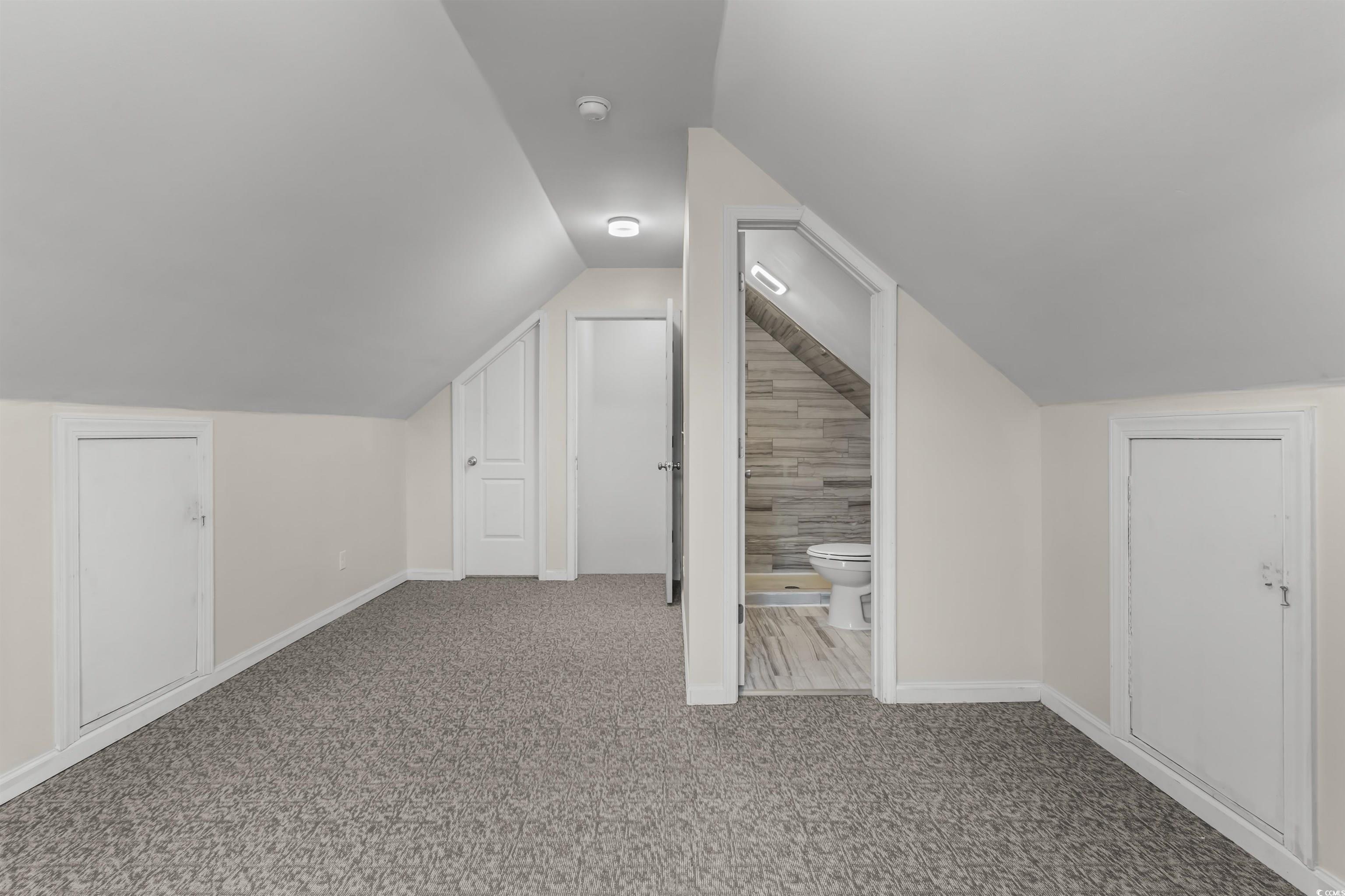 2006 Heritage Loop Myrtle Beach, SC 29577 - Photo 26 of 33 Additional living space with lofted ceiling and carpet