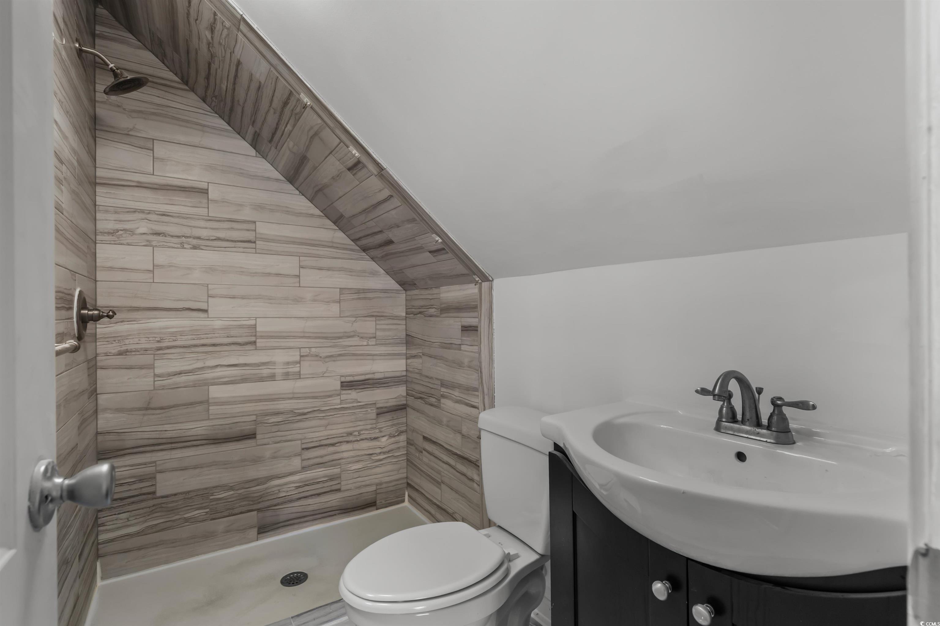 2006 Heritage Loop Myrtle Beach, SC 29577 - Photo 27 of 33 Bathroom with a shower stall, vanity, and lofted ceiling