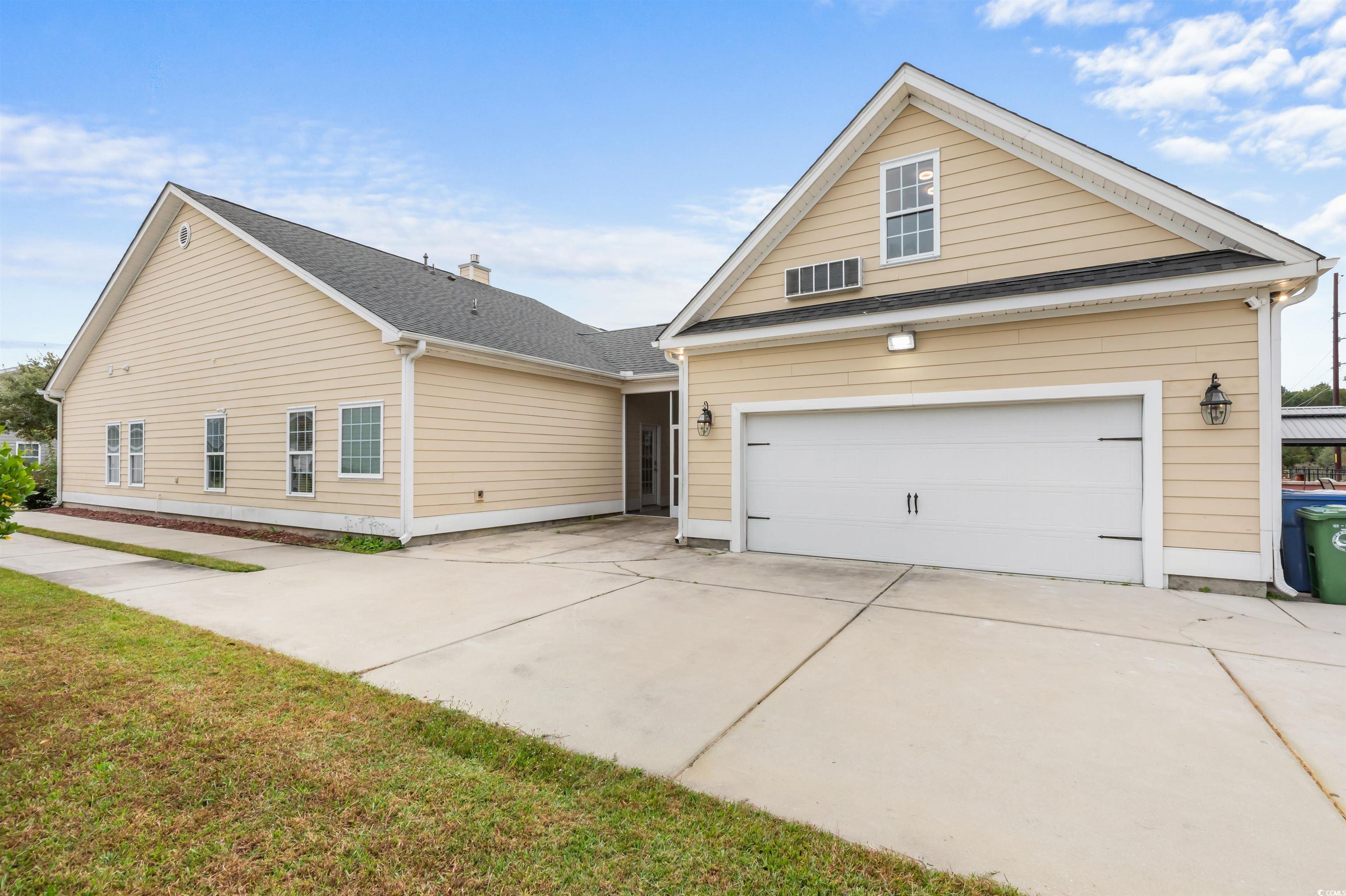 2006 Heritage Loop Myrtle Beach, SC 29577 - Photo 28 of 33 Traditional home with driveway, roof with shingles, and a front lawn