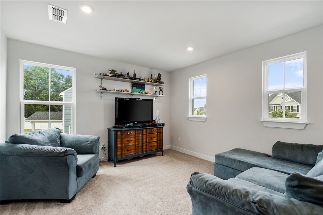 216 Bronson Ridge Anderson, SC 29621 - Photo 24 of 45 A relaxed living area bathed in natural light, perfect for entertainment or quiet enjoyment.