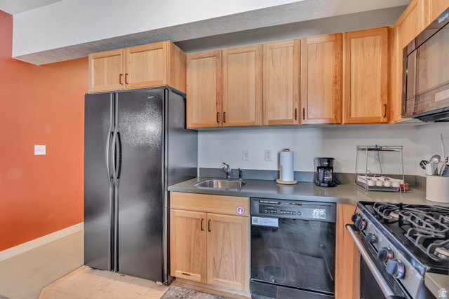 1364 Still Water Drive, Unit R3005 Heber City, UT 84032 - Photo 9 of 28 Kitchen featuring black appliances and light wood finish cabinetry