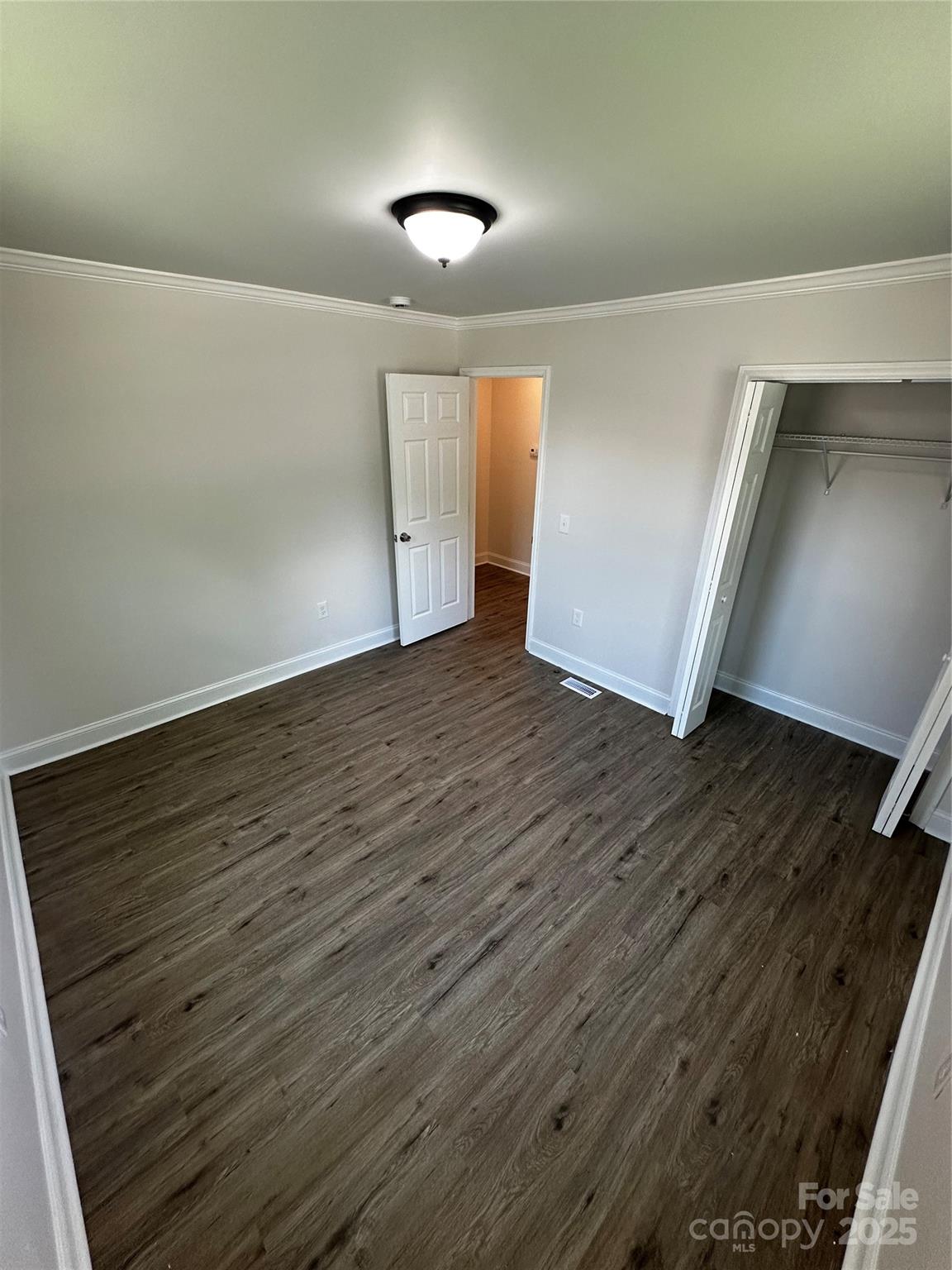 801 Calhoun Street Lancaster, SC 29720 - Photo 6 of 12 wooden floor in an empty room