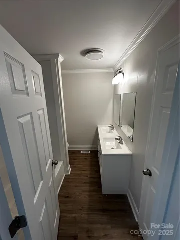 a bathroom with sink a mirror and a shower