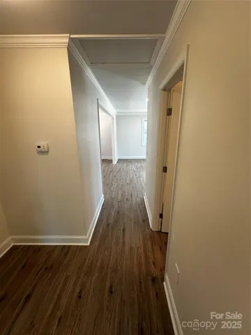 a view of a room with wooden floor and staircase