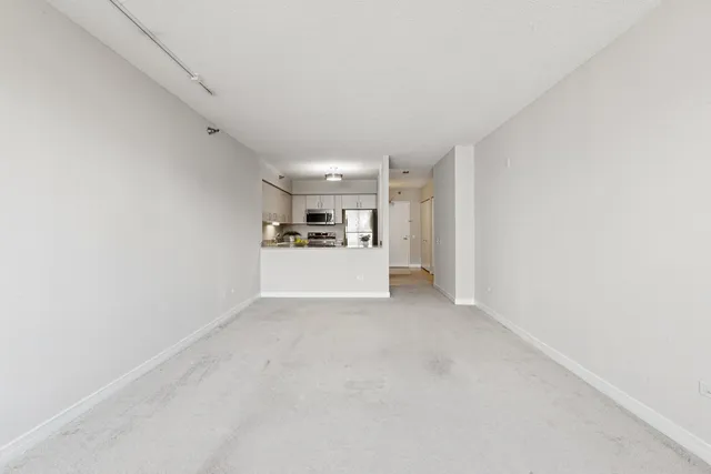 a view of a kitchen with a sink