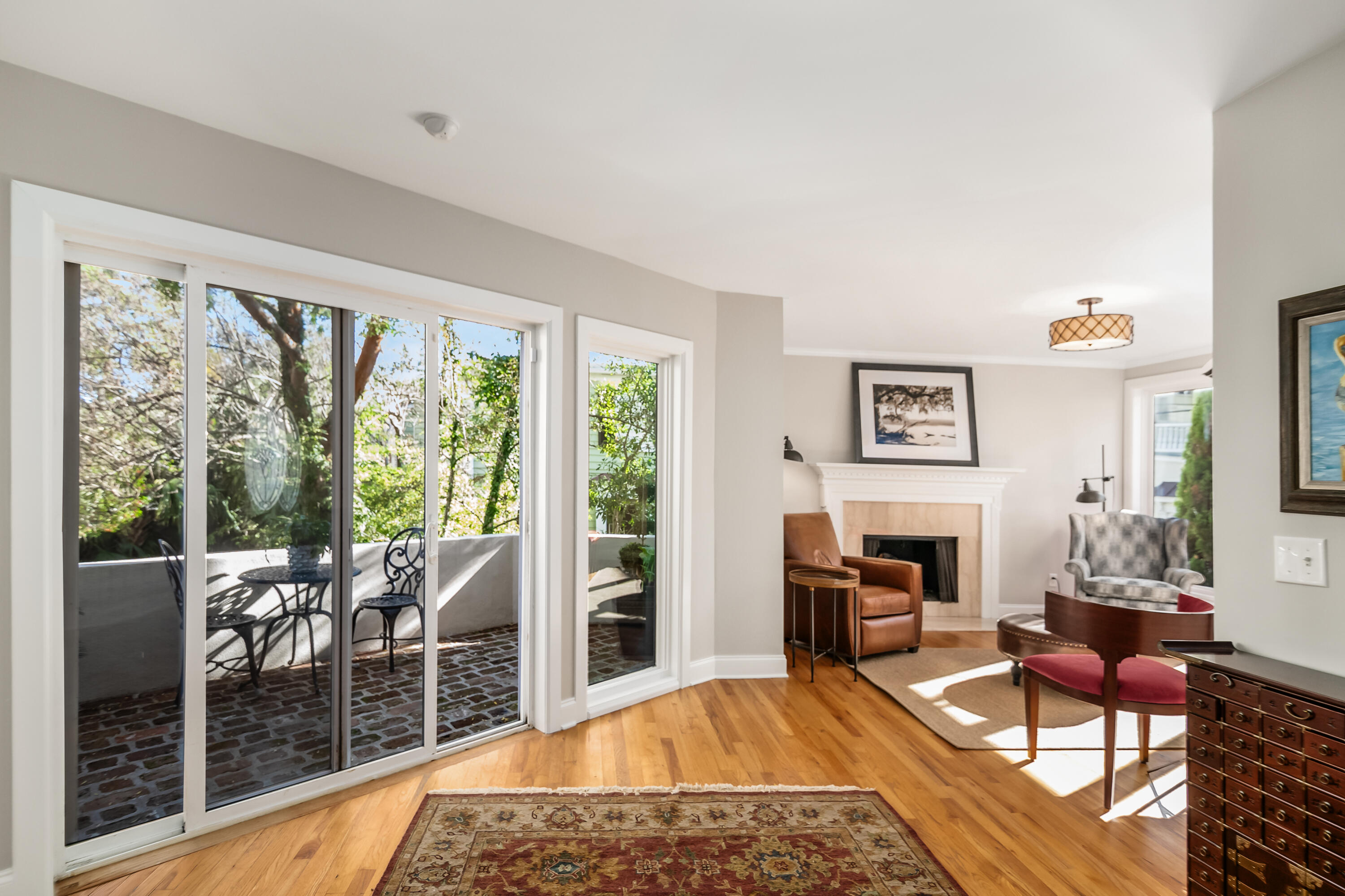 156 Tradd Street, Unit E Charleston, SC 29401 - Photo 3 of 55 Sitting room & patio on first floor