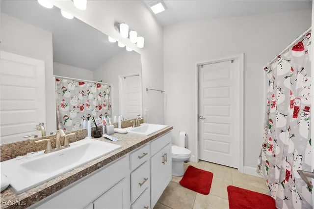 a bed sitting in a bedroom and a table