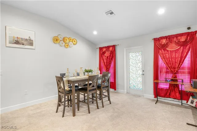 a kitchen with stainless steel appliances kitchen island granite countertop a refrigerator and a stove top oven