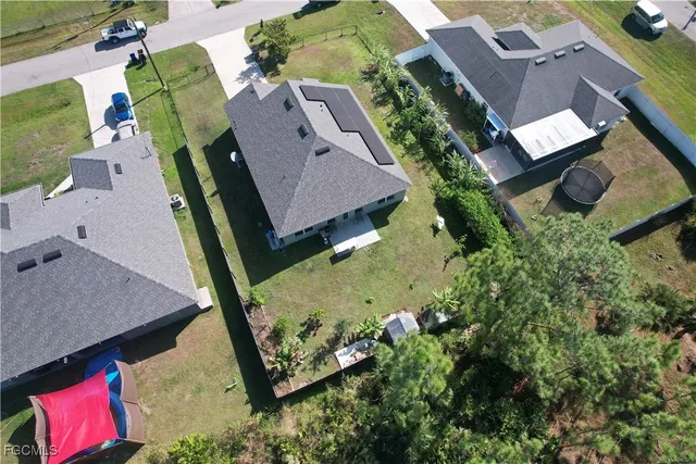 an aerial view of houses with yard