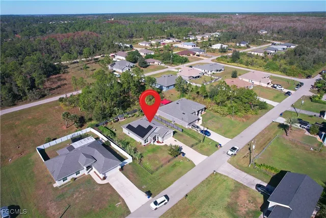 an aerial view of a house with a garden