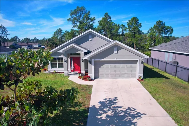 a front view of a house with yard
