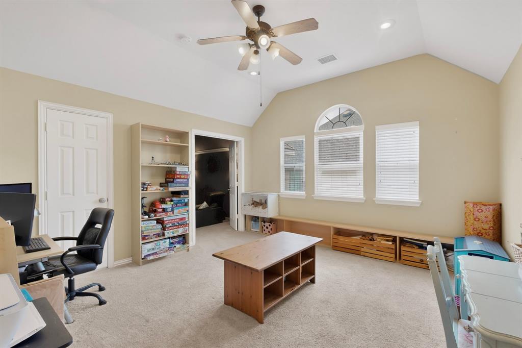4004 White Porch Road Plano, TX 75024 - Photo 31 of 40 a living room with furniture and a chandelier