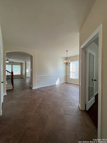 a view of a big room with closet and windows
