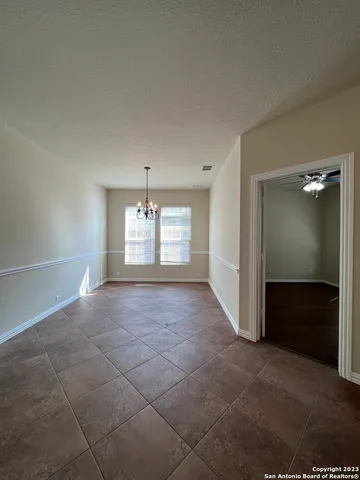 a view of an empty room and a bathroom
