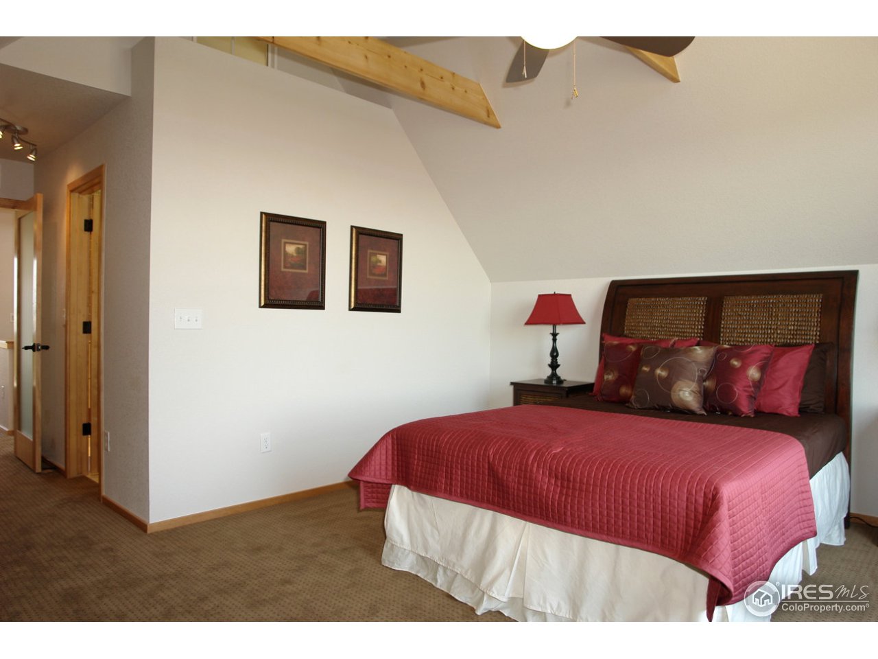 2834 Rigden Parkway Fort Collins, CO 80525 - Photo 12 of 18 a bedroom with a bed and a painting