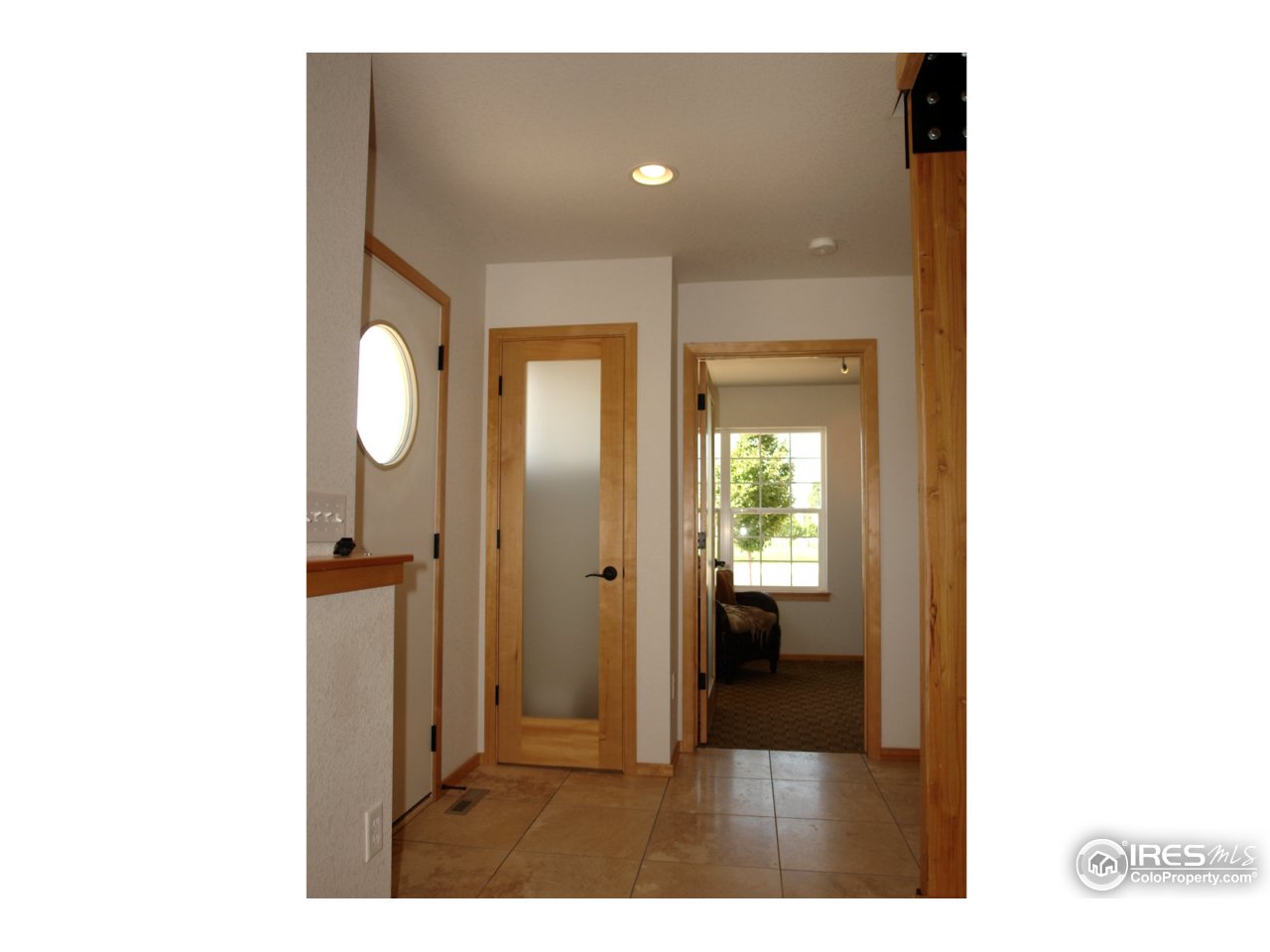 2834 Rigden Parkway Fort Collins, CO 80525 - Photo 2 of 18 a view of a bathroom with sink mirror and window