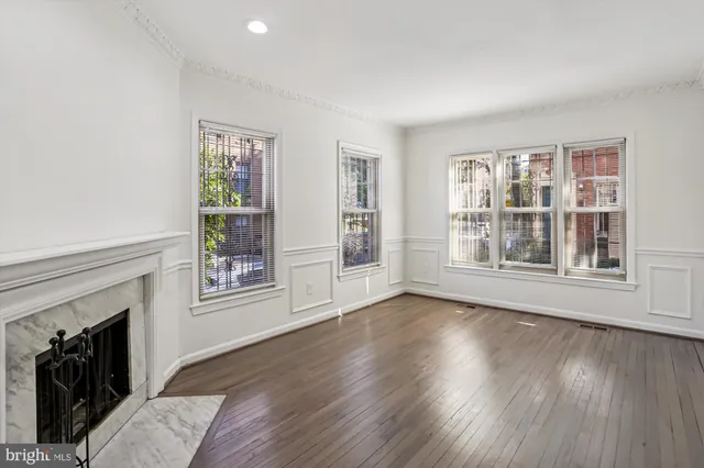 a view of livingroom with furniture wooden floor and window