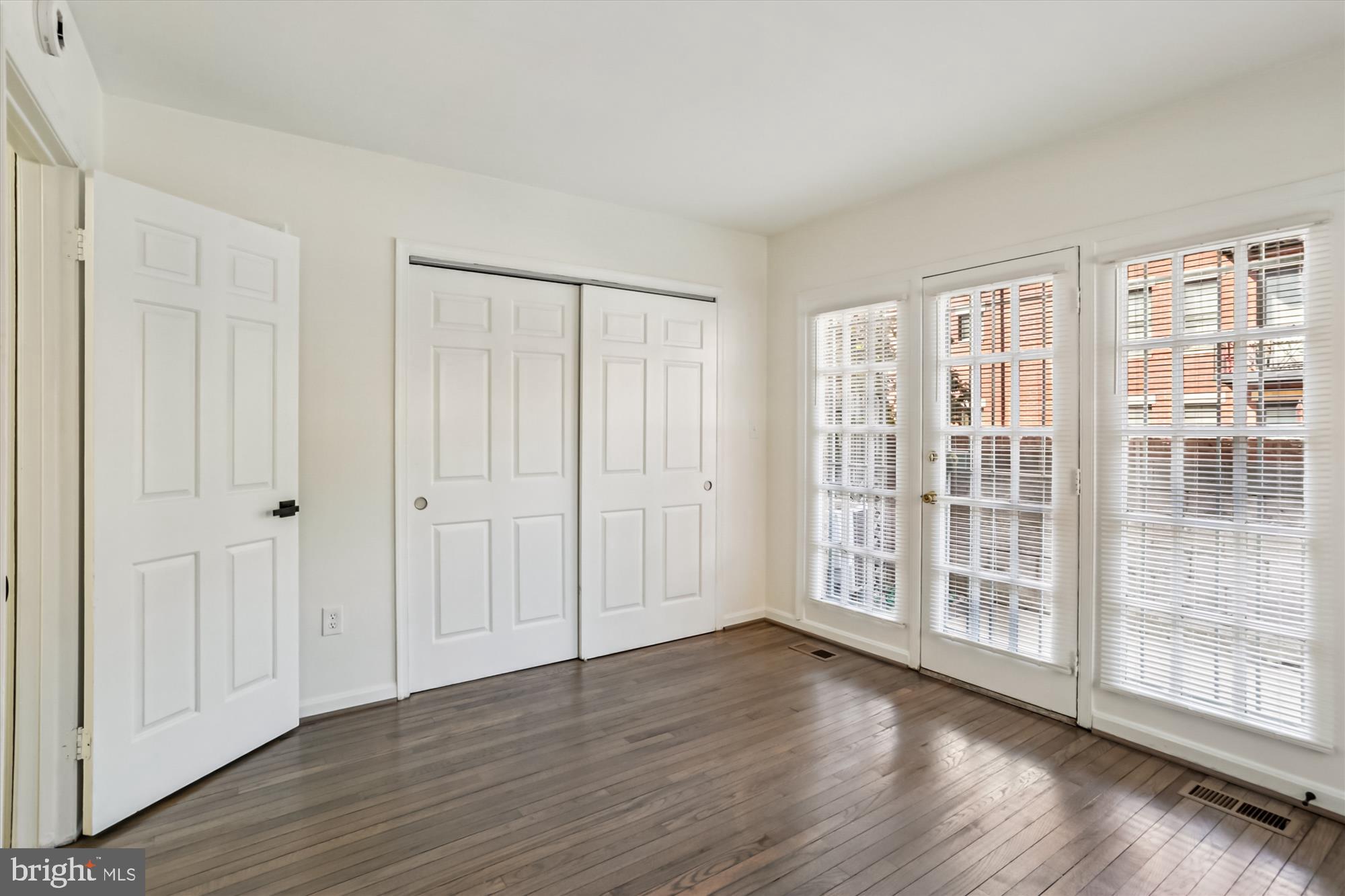 1690 Euclid Street Northwest, Unit A Washington, DC 20009 - Photo 25 of 38 a view of an empty room with wooden floor and entryway