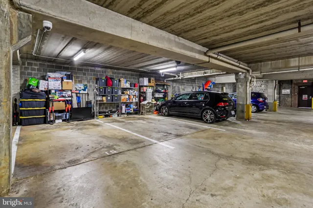 a view of a garage with cars