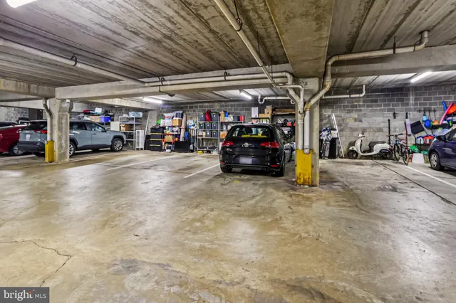 a view of a garage with cars