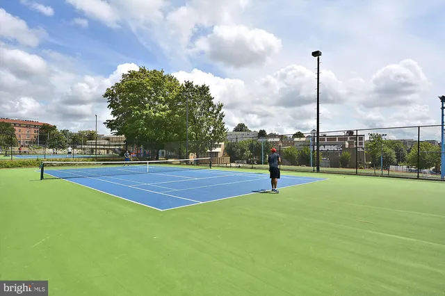 a park view with a playing space and trampoline