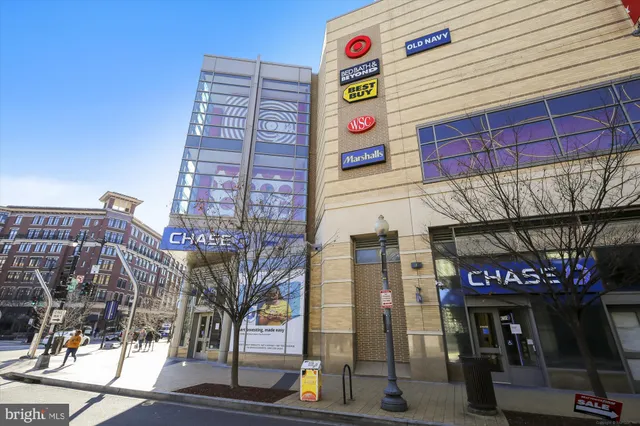 a front view of a building with retail shops