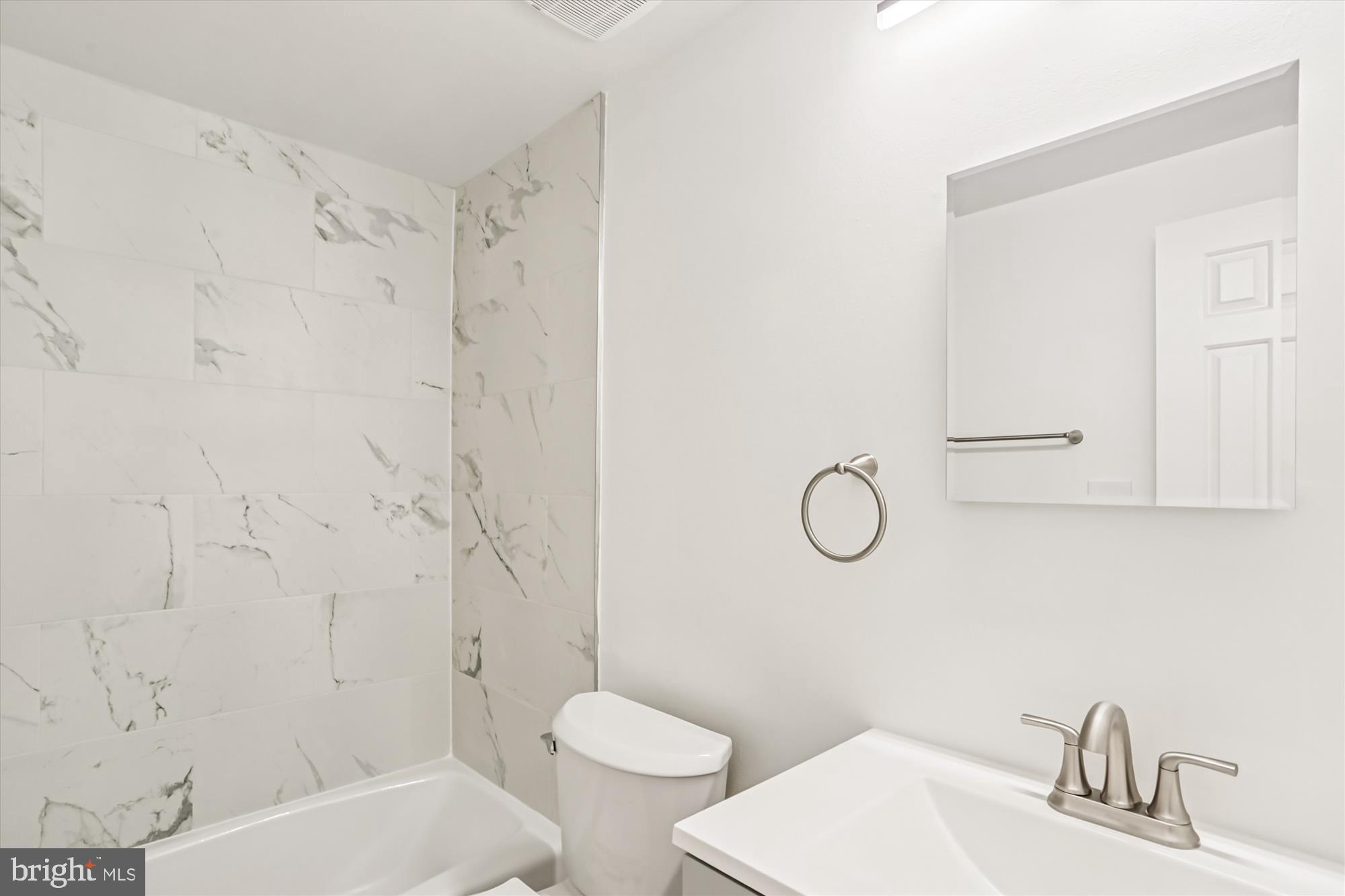 1690 Euclid Street Northwest, Unit A Washington, DC 20009 - Photo 6 of 38 a bathroom with a sink toilet and shower