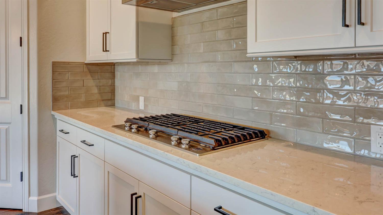 1742 North Applegate Avenue Clovis, CA 93619 - Photo 11 of 31 a close view of a stove a microwave and cabinets in the kitchen