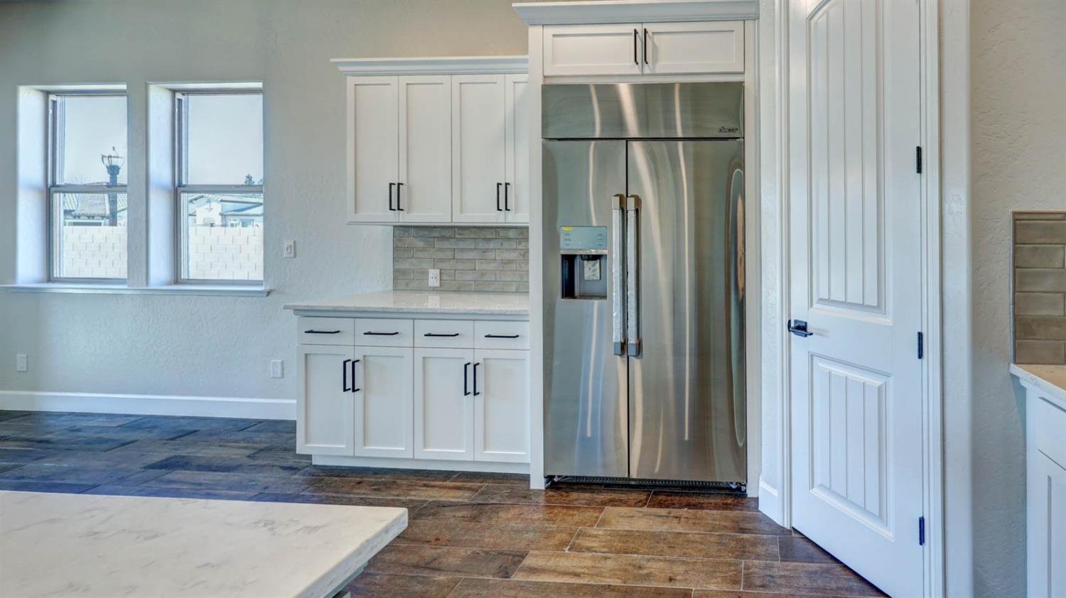 1742 North Applegate Avenue Clovis, CA 93619 - Photo 12 of 31 an empty room with windows and cabinet