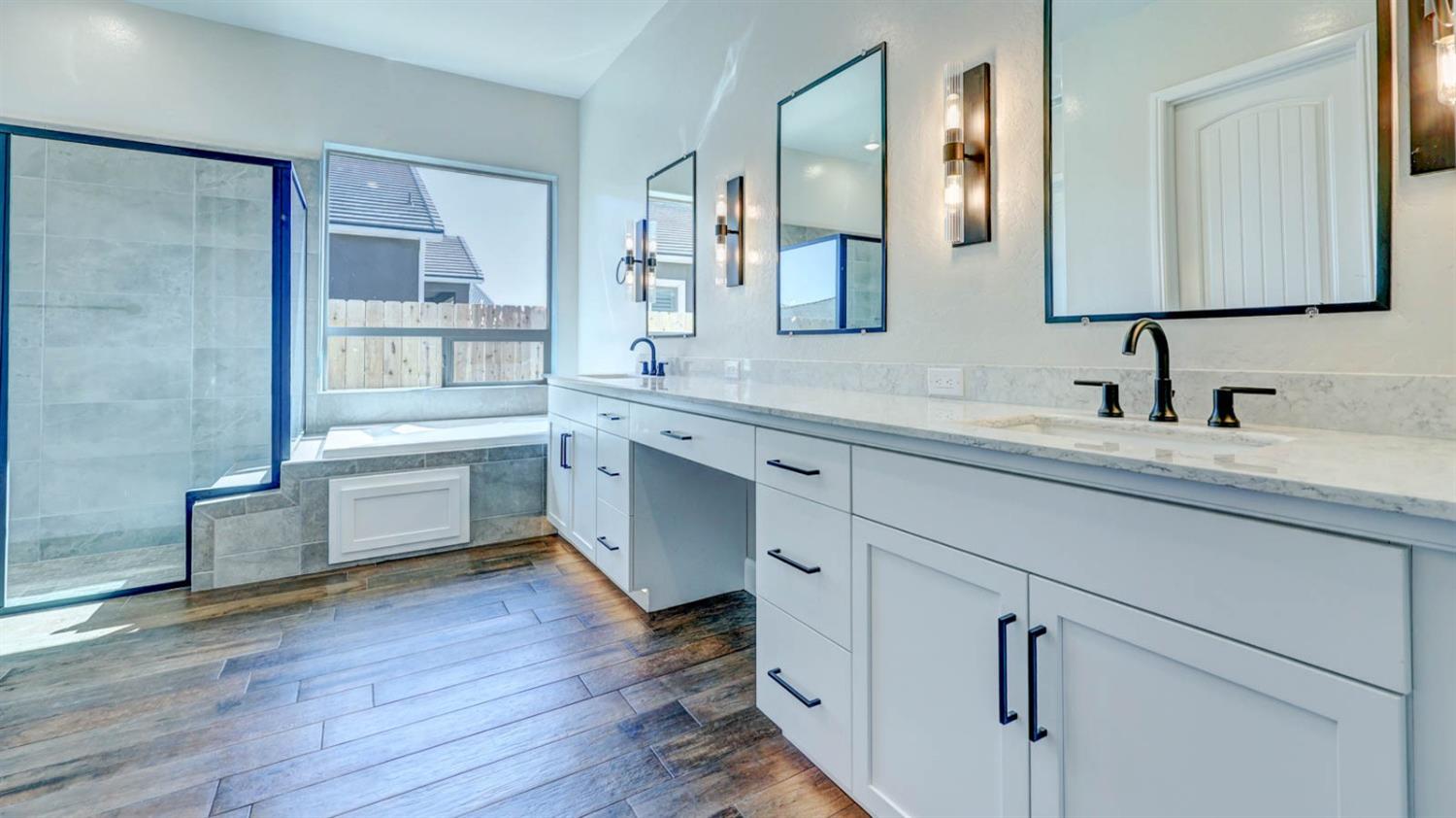 1742 North Applegate Avenue Clovis, CA 93619 - Photo 24 of 31 a kitchen with a sink cabinets and wooden floor