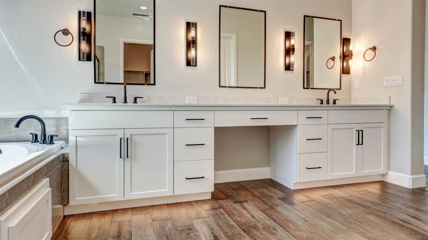 1742 North Applegate Avenue Clovis, CA 93619 - Photo 26 of 31 a bathroom with a sink and a mirror