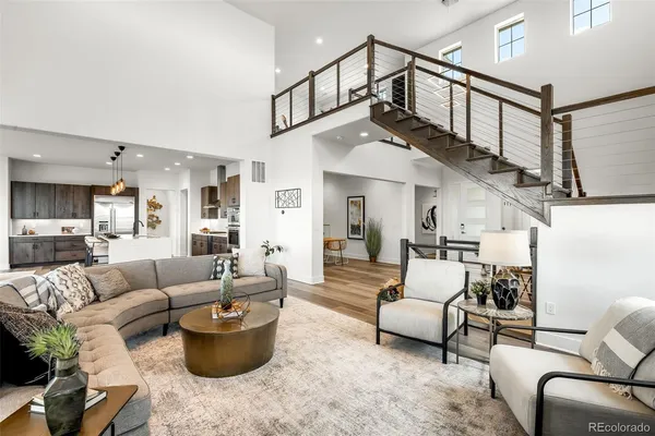a living room with furniture or kitchen view and a wooden floor