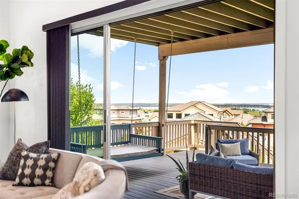 a balcony view with a seating space