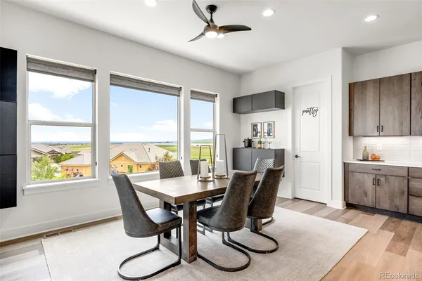 a dining room with furniture window wooden floor