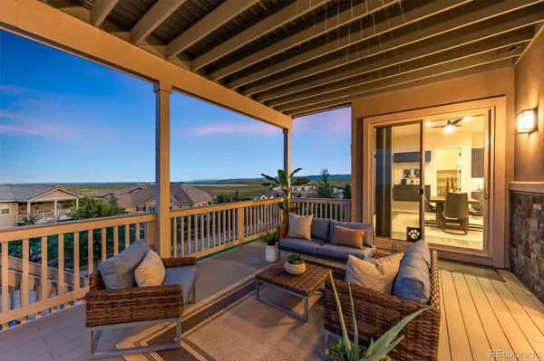 a view of a balcony with chairs