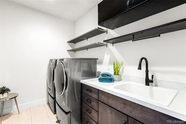 a large bedroom with a bed and a large window