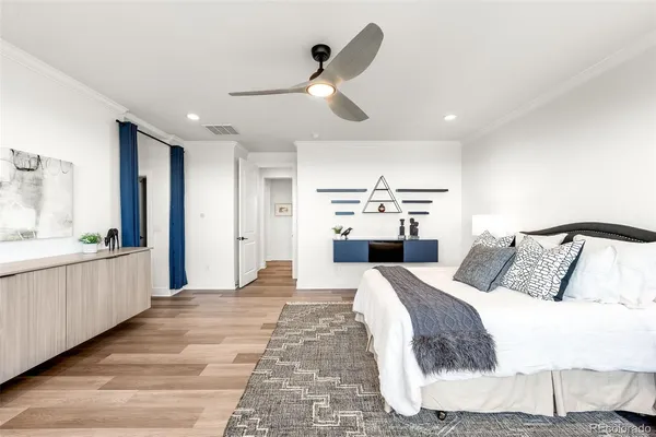 a view of a room that has a bed and a window